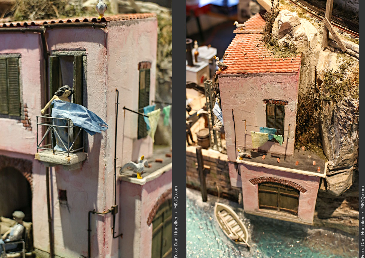 Frau mit Badetuch + Haus am Meer
